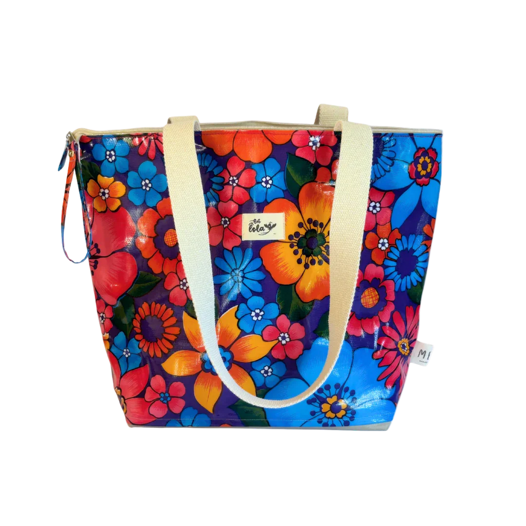 Colorful floral tote bag with cream handles and vibrant blue, orange, and red flowers