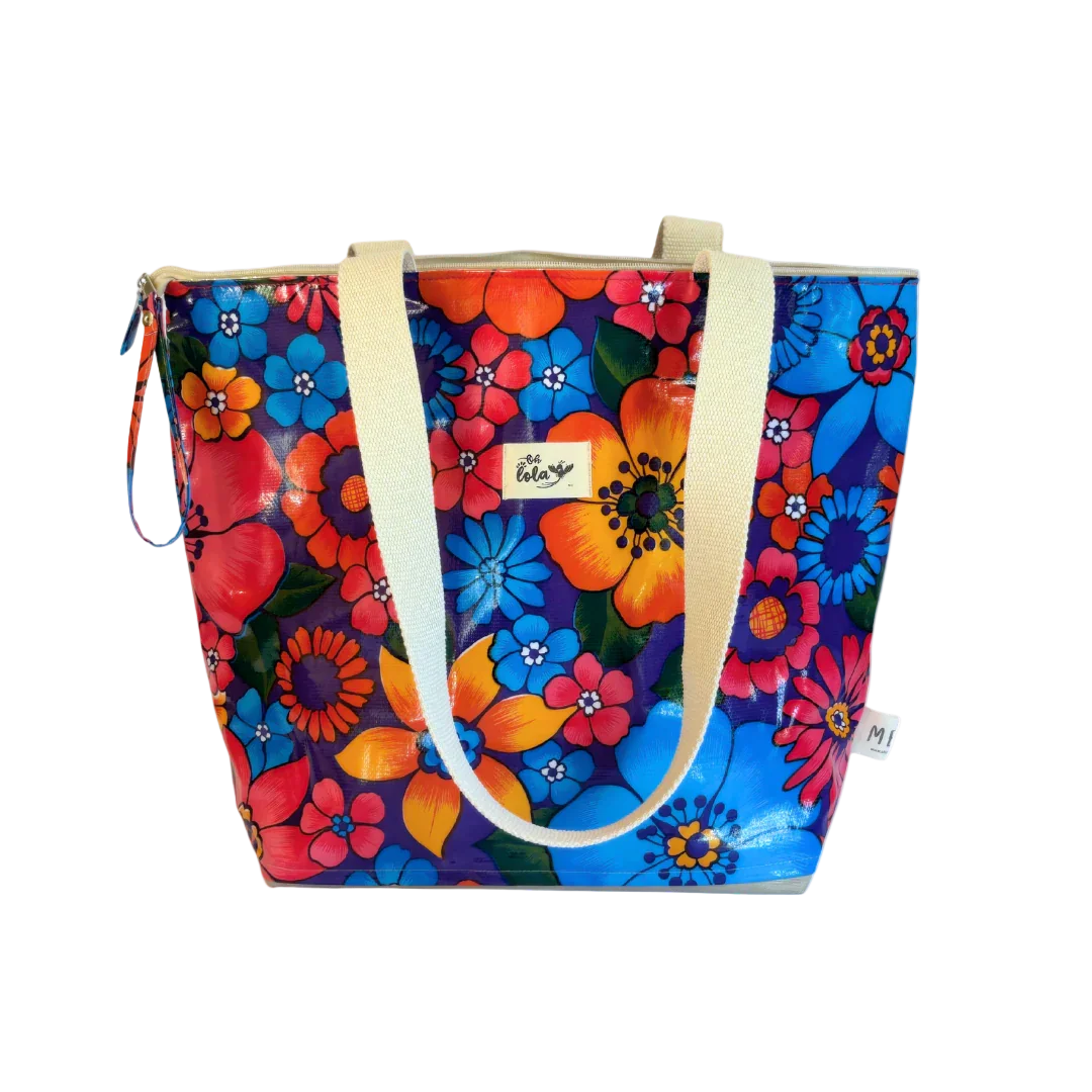 Colorful floral tote bag with cream handles and vibrant blue, orange, and red flowers
