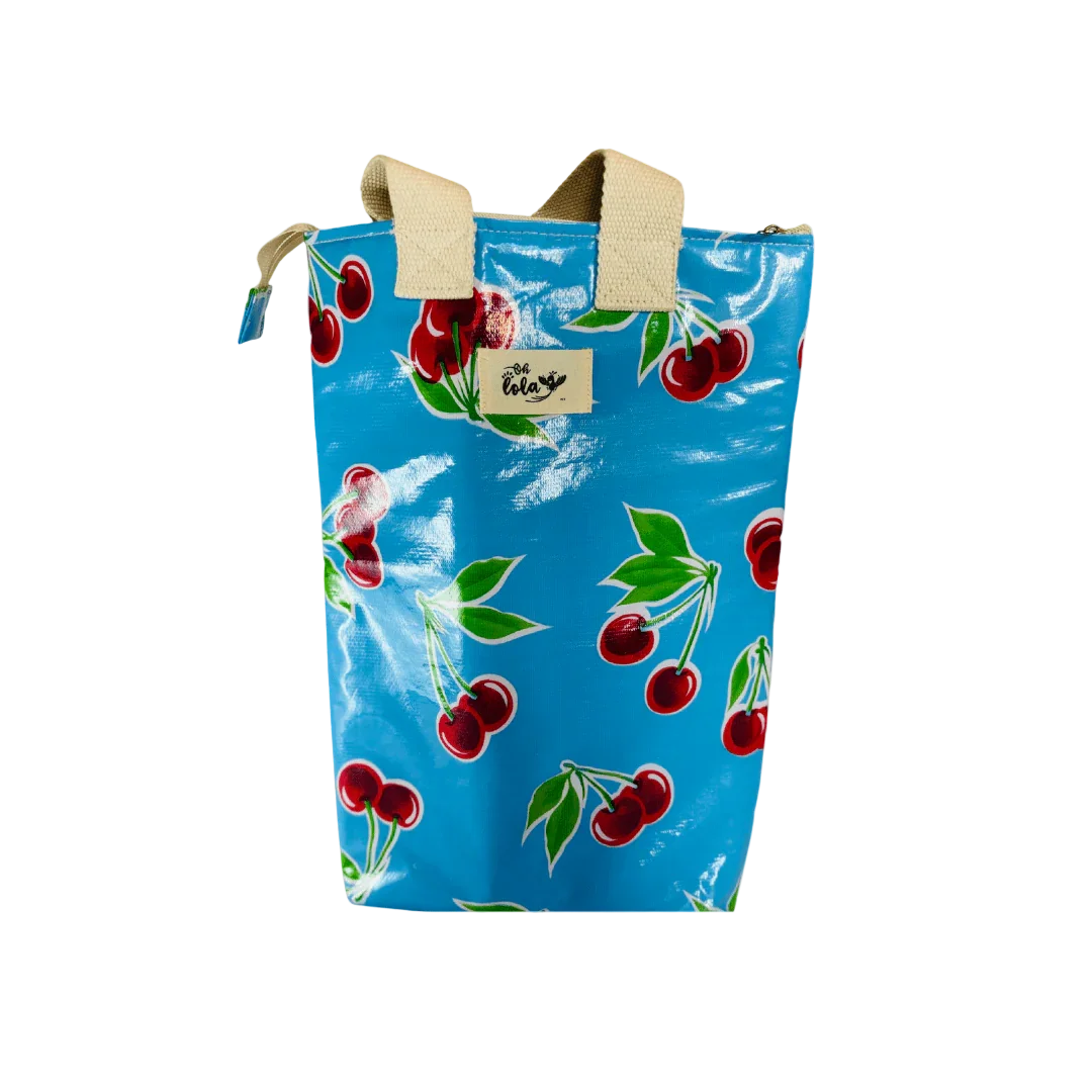 Blue cherry print tote bag with beige handles and zipper closure