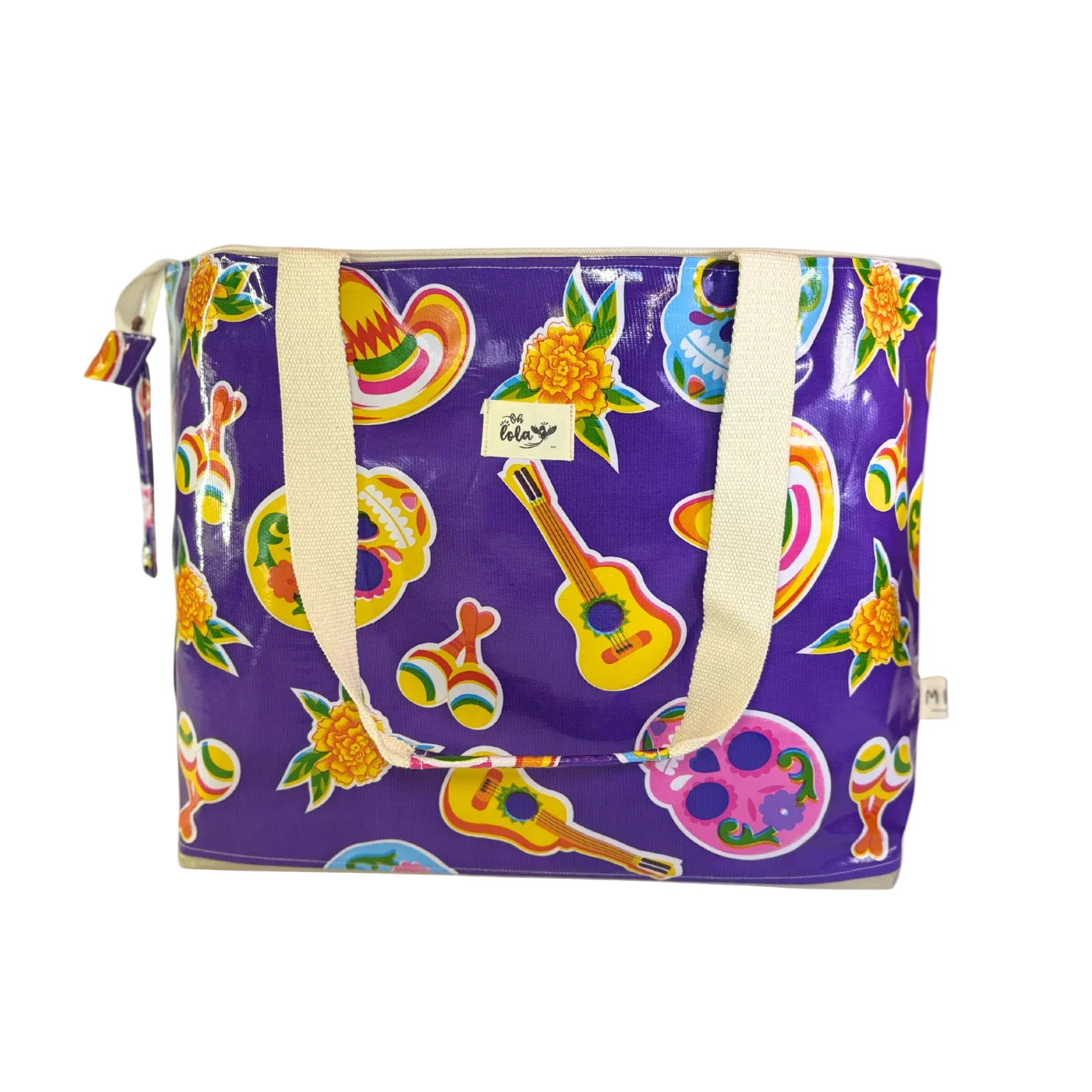 Purple tote bag with colorful Mexican-themed prints including guitars, sombreros, maracas, skulls, and marigold flowers