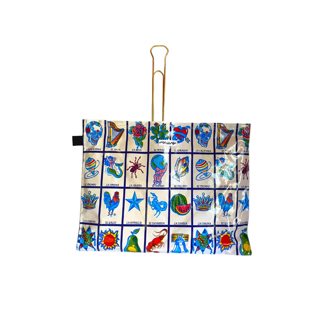 Colorful tote bag with Lotería card icons including La Calavera, El Arpa, La Rosa, and El Corazón
