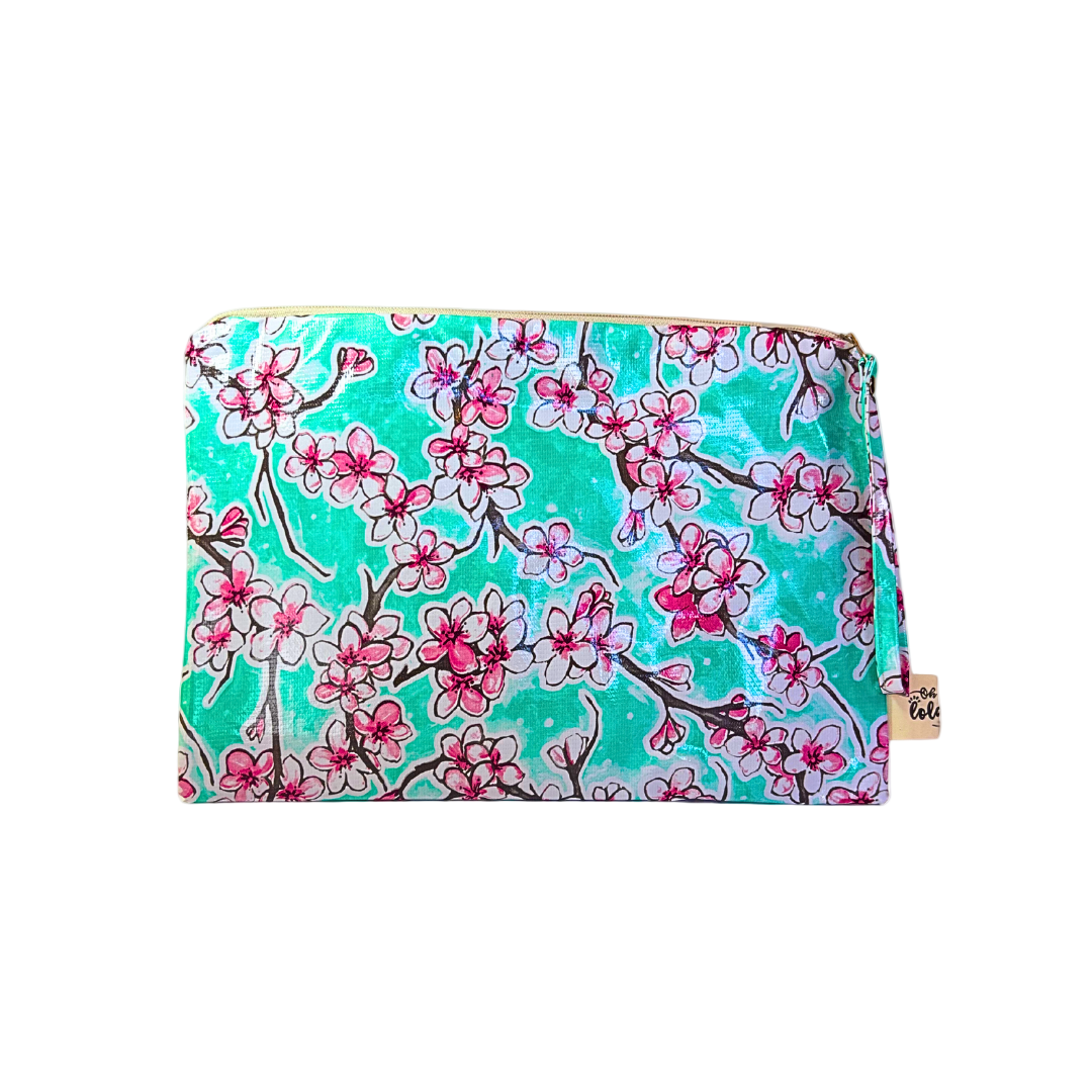 Floral patterned pouch with pink flowers on a teal background