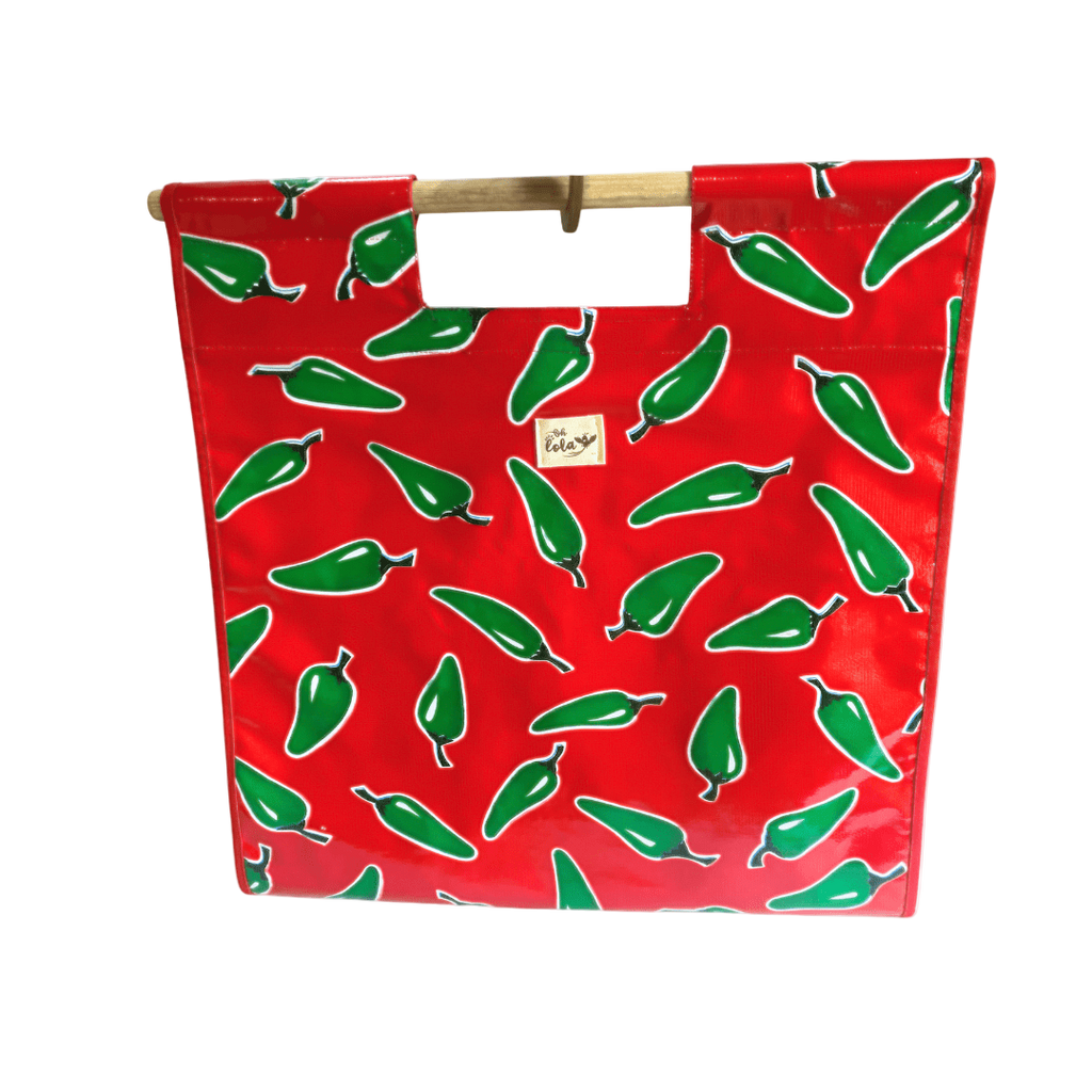 Red tote bag with green chili pepper print and wooden handles