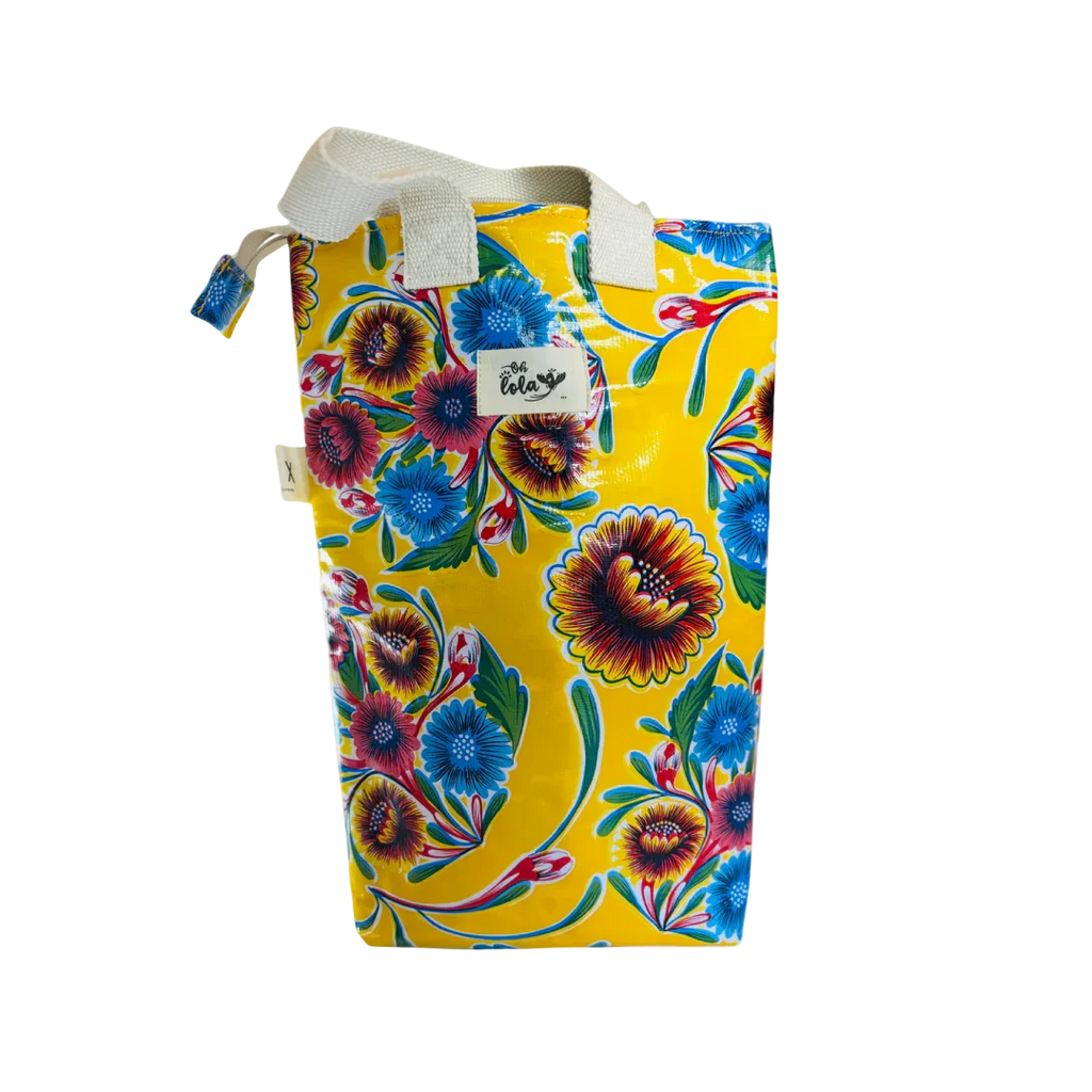 Yellow floral patterned waterproof tote bag with blue, red flowers and white handles