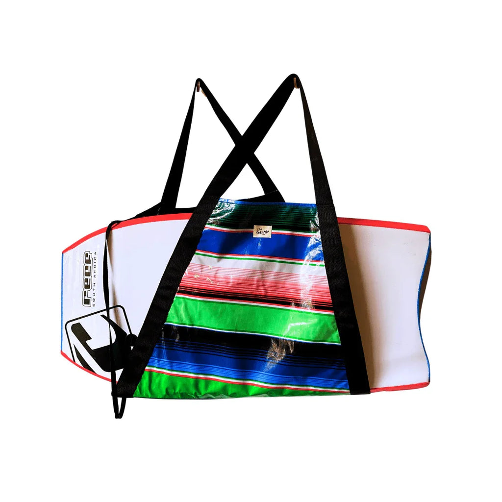 Colorful striped surfboard bag with black cross straps and white padded ends