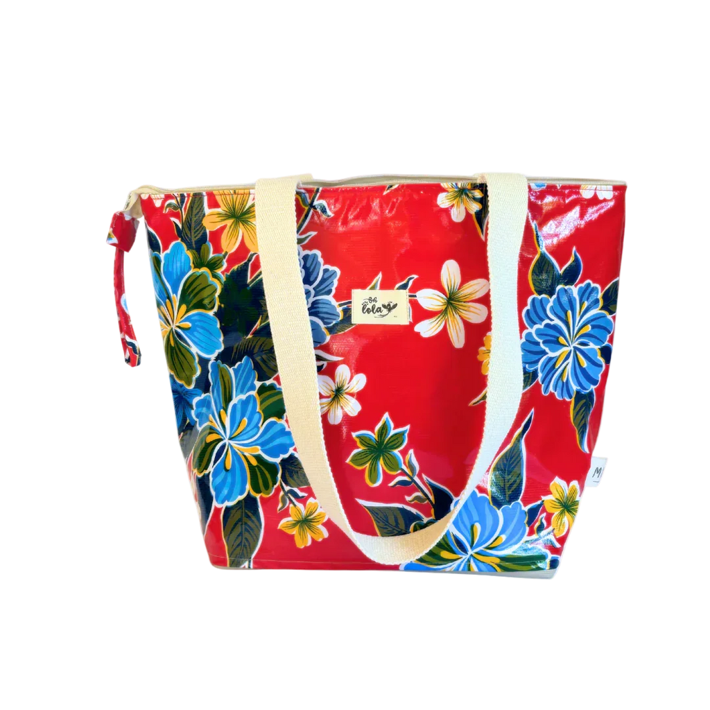 Red floral tote bag with blue and yellow flowers, white handles, and a small label