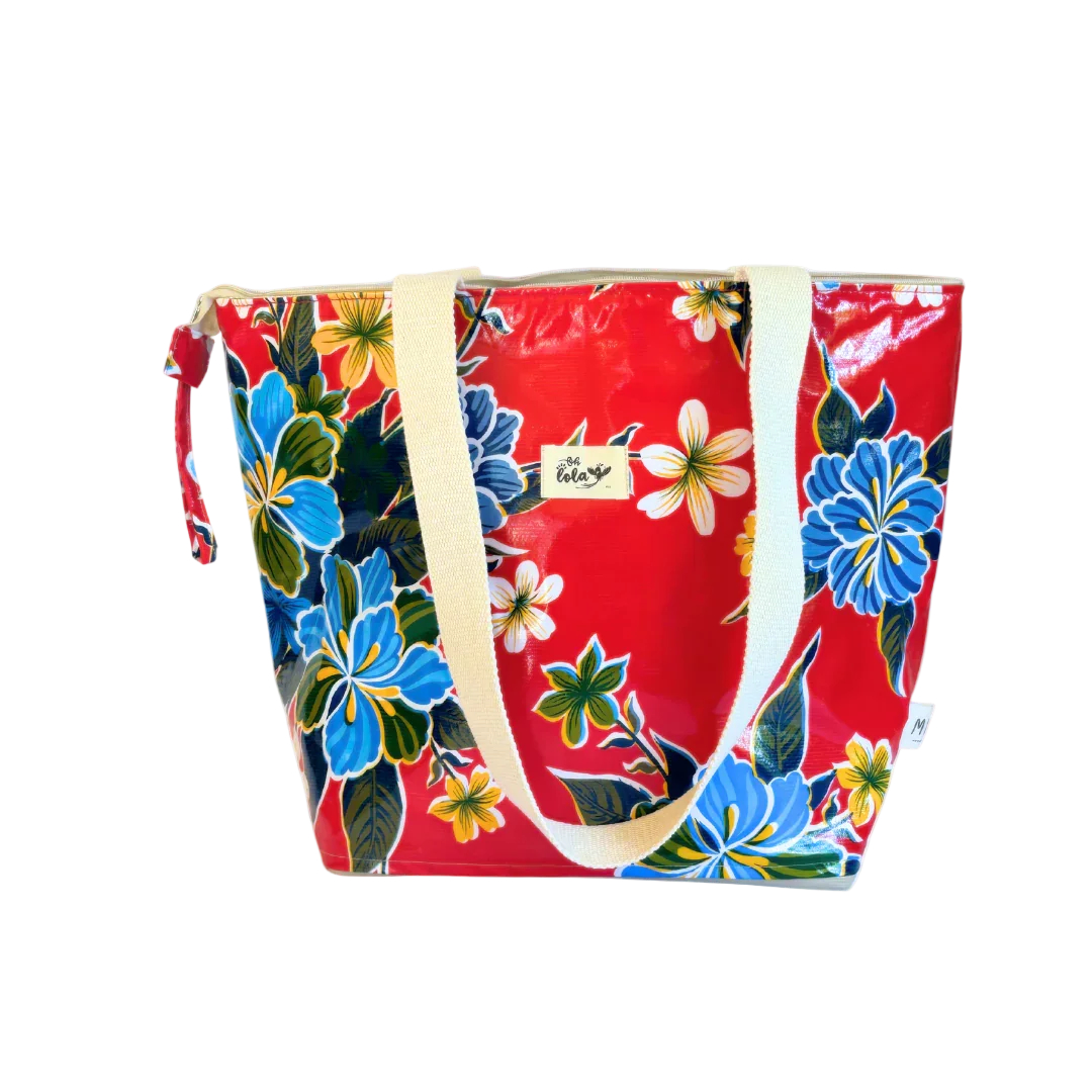 Red floral tote bag with blue and yellow flowers, white handles, and a small label