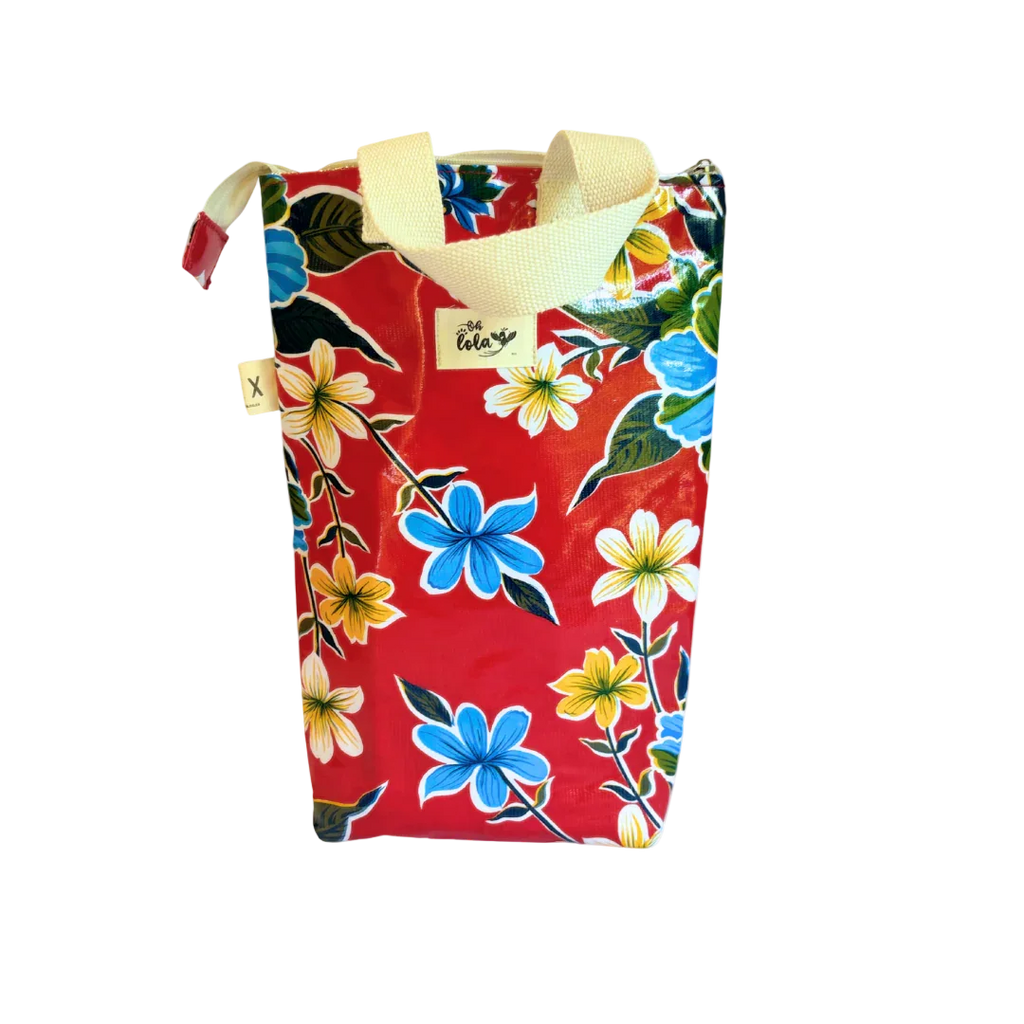 Red floral print tote bag with blue, yellow, white flowers and cream handles