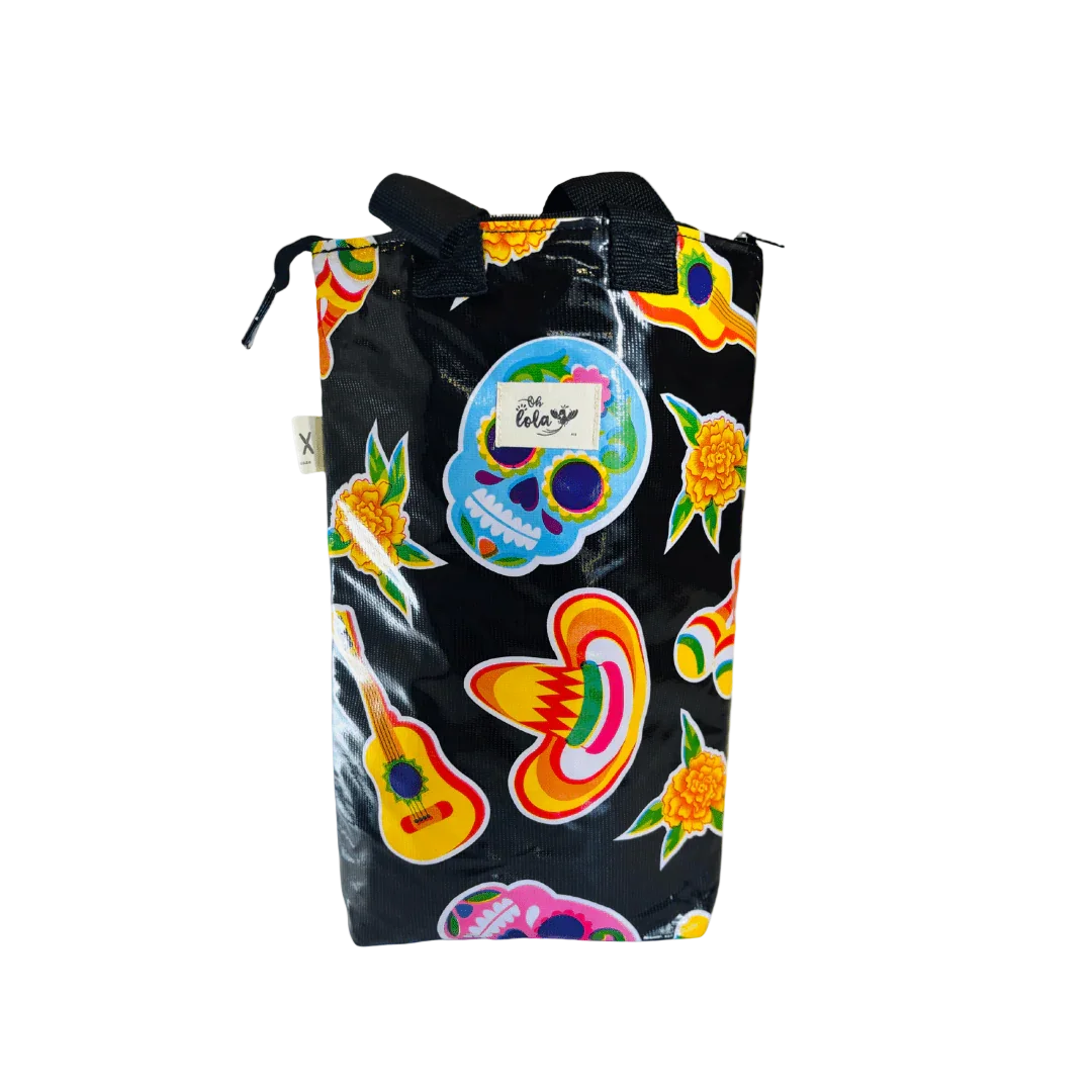 Black bag with colorful Day of the Dead sugar skulls, sombreros, marigold flowers, and guitar designs