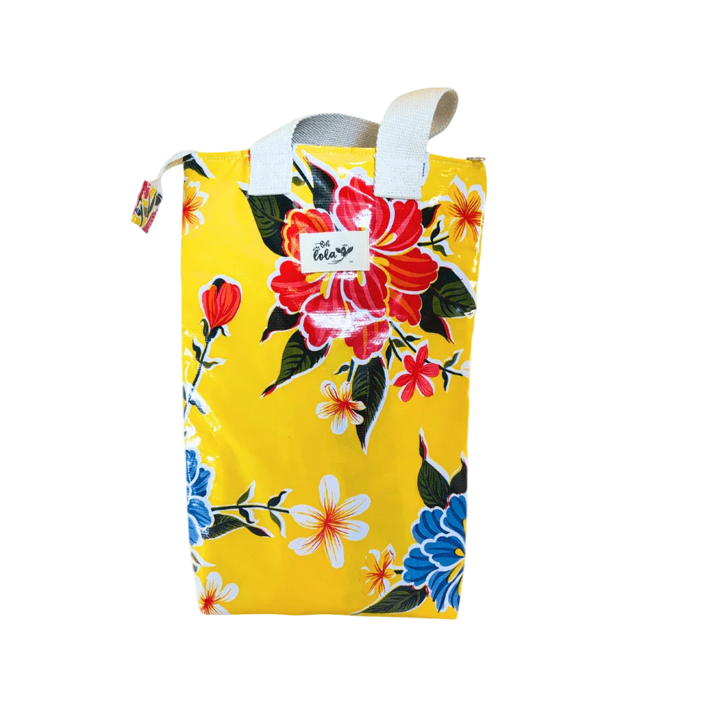 Yellow bag with vibrant red, blue, and white floral pattern and white handles