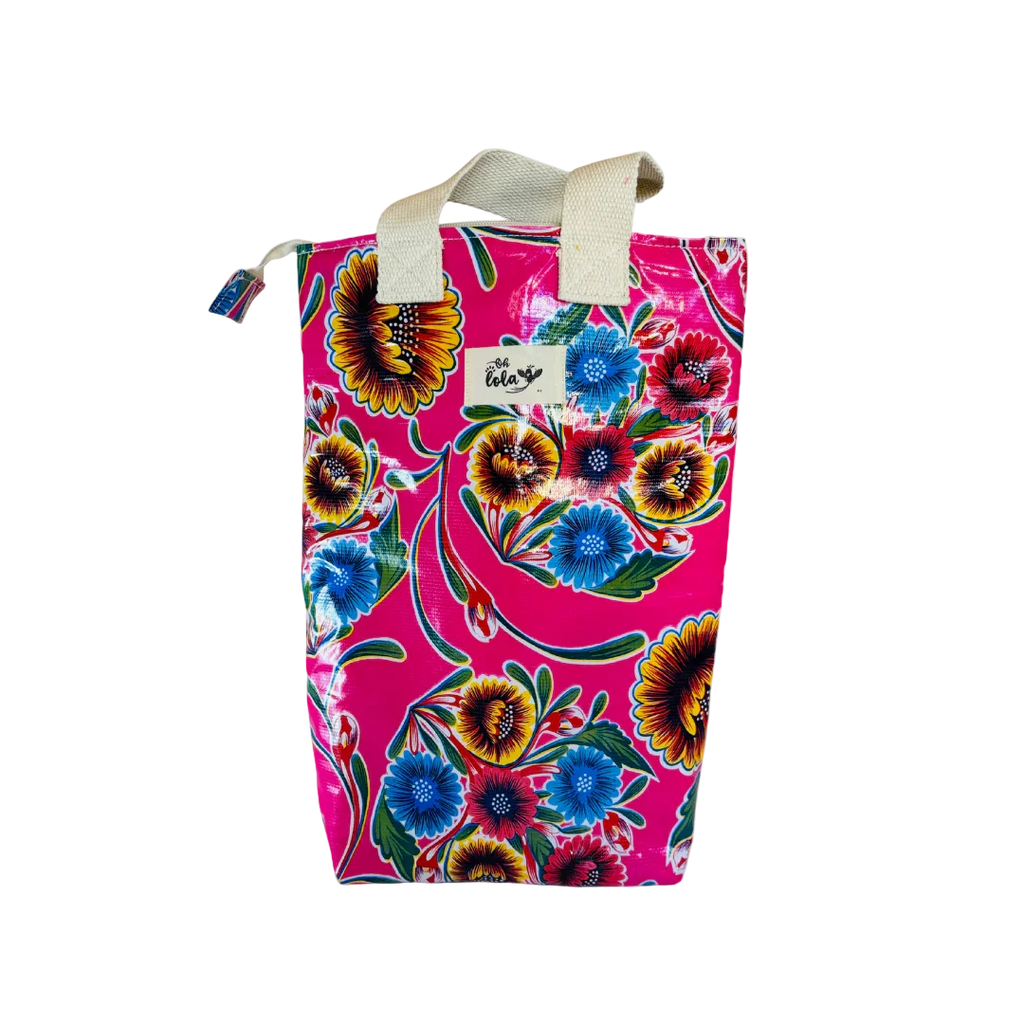 Colorful pink floral tote bag with blue and yellow flowers and white handles