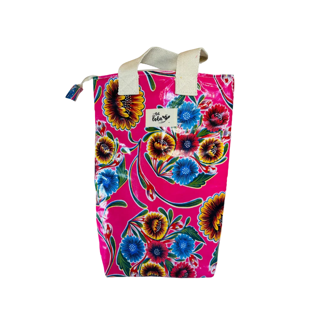 Colorful pink floral tote bag with blue and yellow flowers and white handles